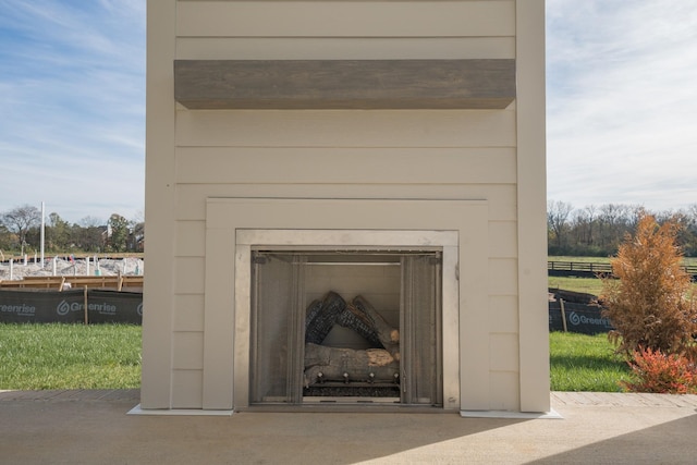 exterior details featuring exterior fireplace