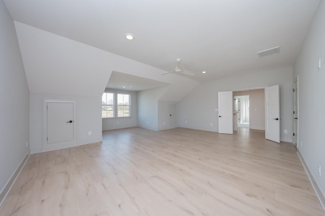 additional living space featuring light hardwood / wood-style floors, ceiling fan, and lofted ceiling