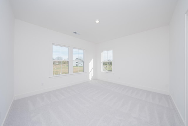 empty room with light colored carpet