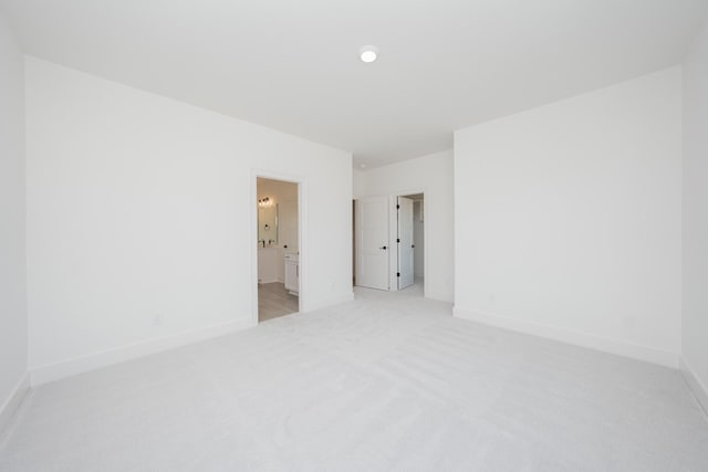 spare room with light colored carpet