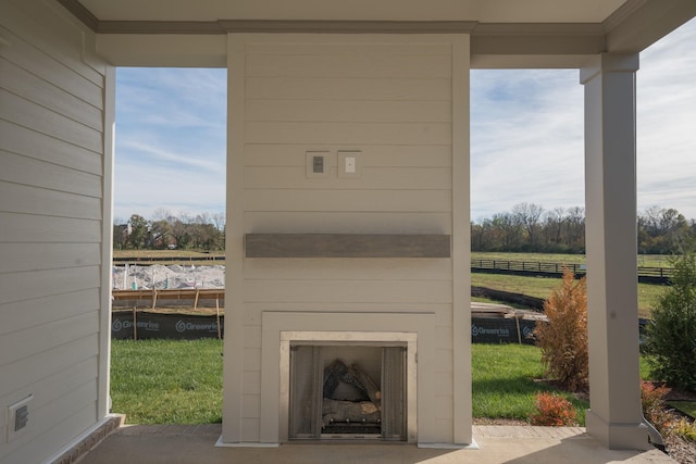 view of patio / terrace with exterior fireplace