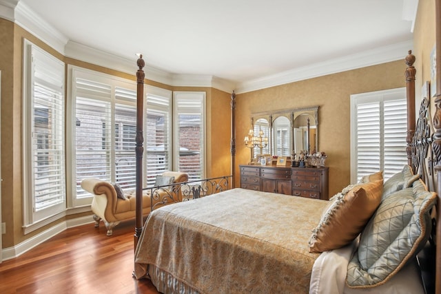 bedroom with crown molding and dark hardwood / wood-style flooring