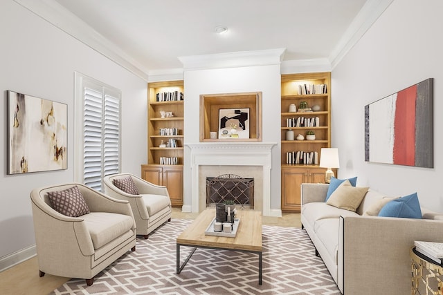 sitting room featuring built in features and crown molding