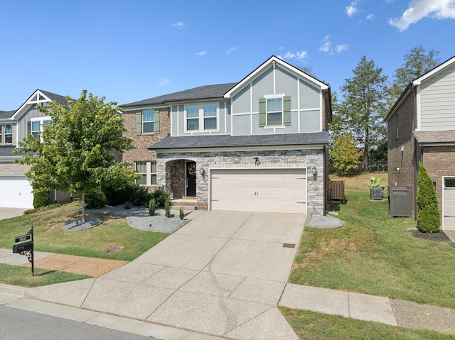 view of front of home with a front yard and a garage