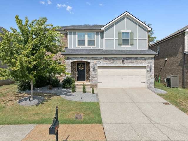 view of front of house with a garage and a front yard