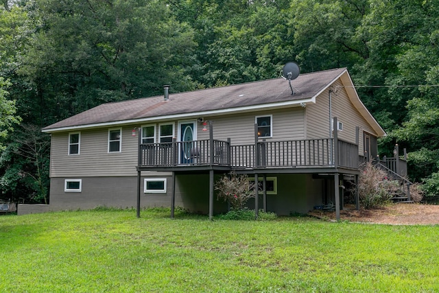 back of house with a lawn and a wooden deck