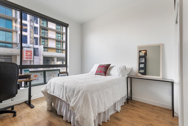 bedroom with wood-type flooring