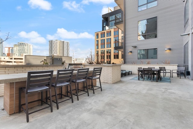 view of patio / terrace featuring an outdoor bar