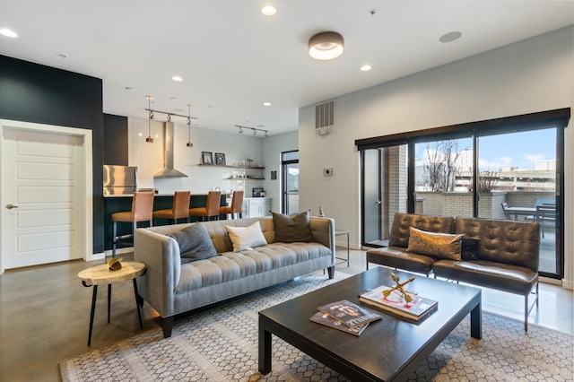 living room featuring track lighting