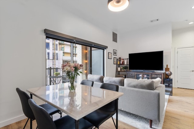 dining room featuring light hardwood / wood-style floors