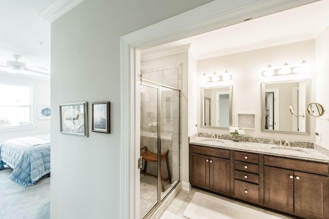 bathroom featuring ceiling fan, an enclosed shower, ornamental molding, and vanity