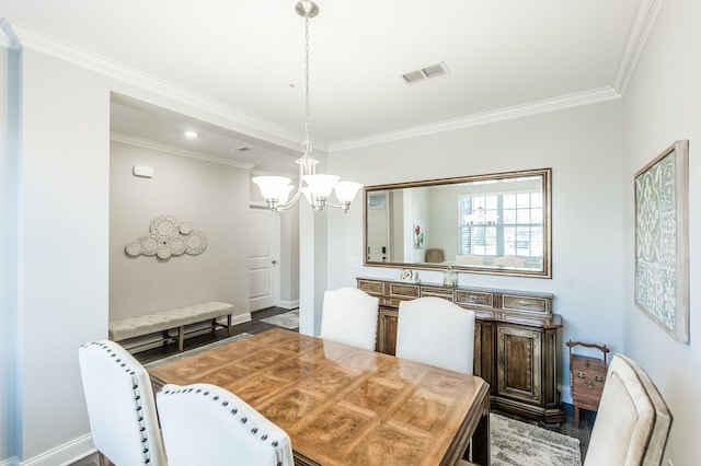 dining room featuring crown molding and a notable chandelier