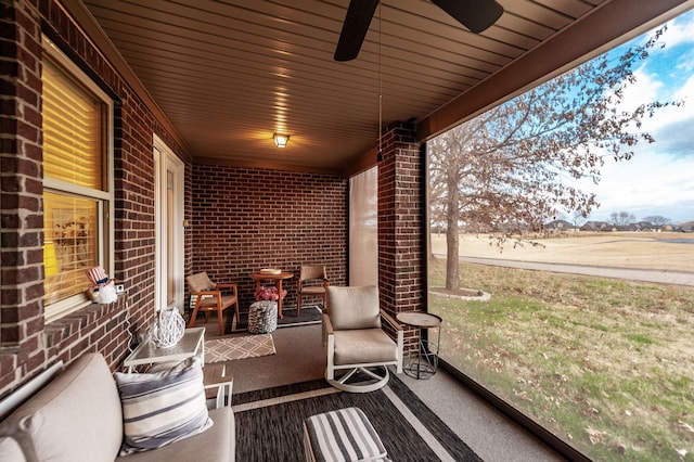 exterior space featuring ceiling fan