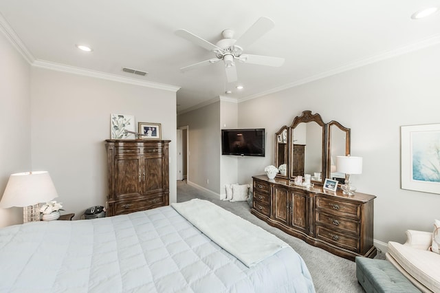 carpeted bedroom featuring ceiling fan and crown molding