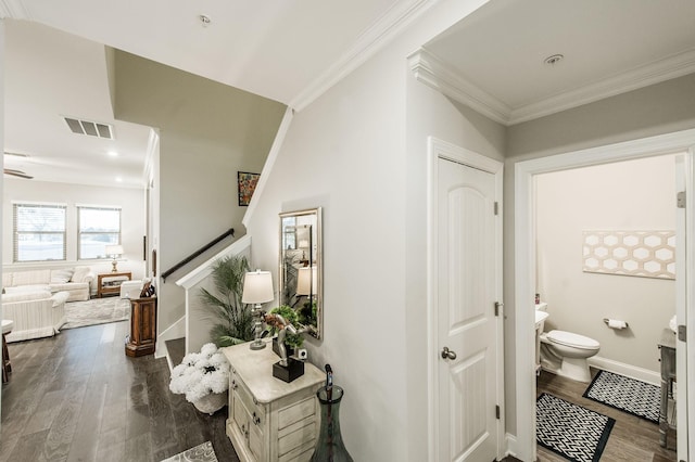 hallway featuring dark hardwood / wood-style flooring and ornamental molding