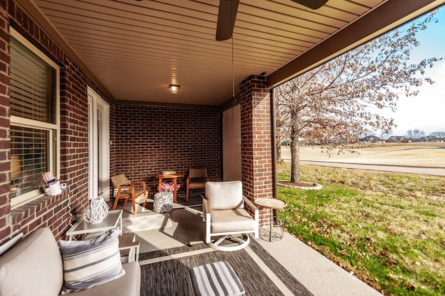 view of patio featuring ceiling fan