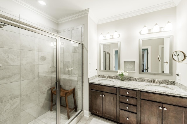 bathroom with tile patterned floors, vanity, crown molding, and walk in shower