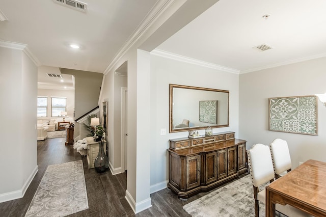 corridor with dark hardwood / wood-style floors and crown molding