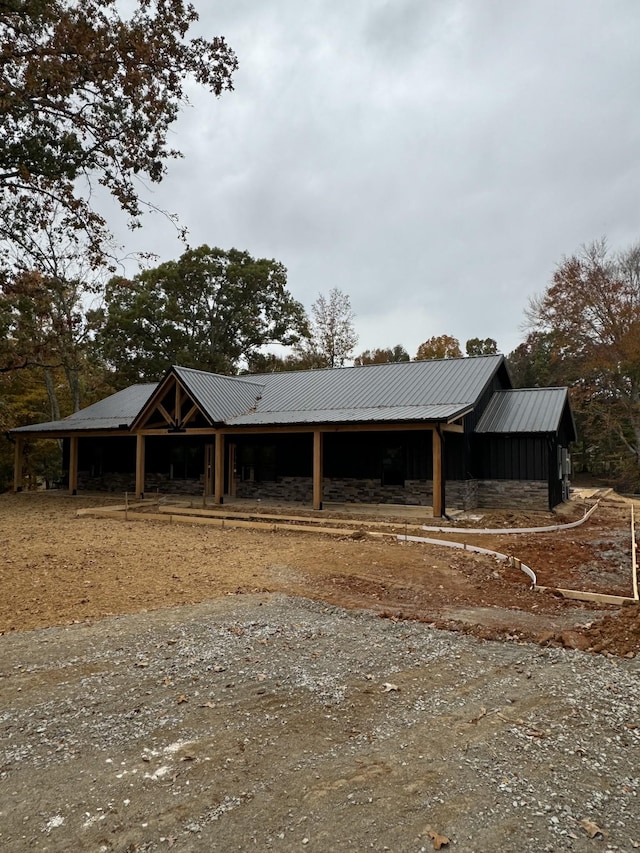 exterior space with a carport and an outdoor structure