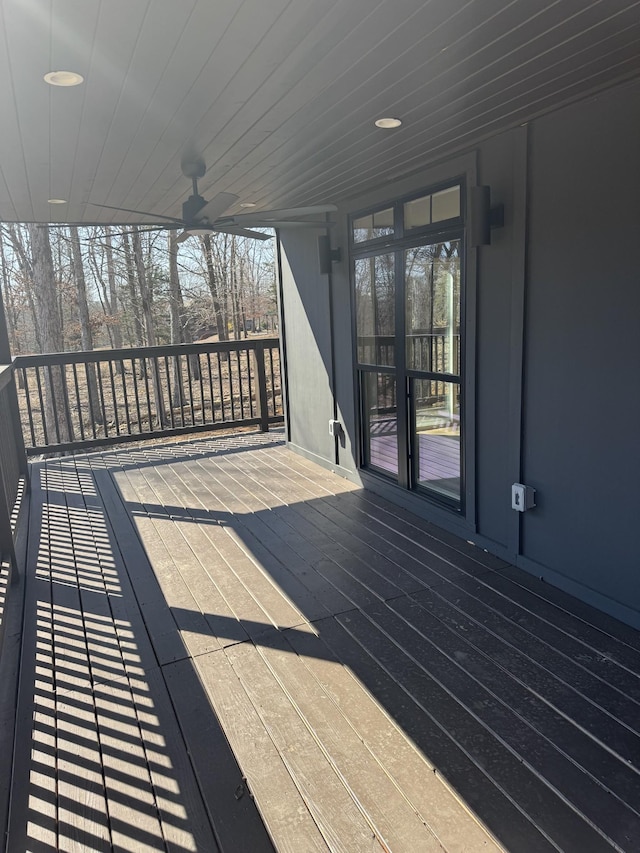 wooden deck featuring ceiling fan