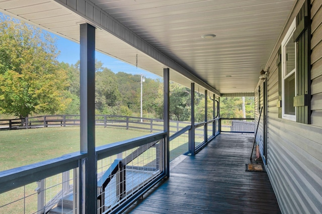 deck with a lawn and a porch