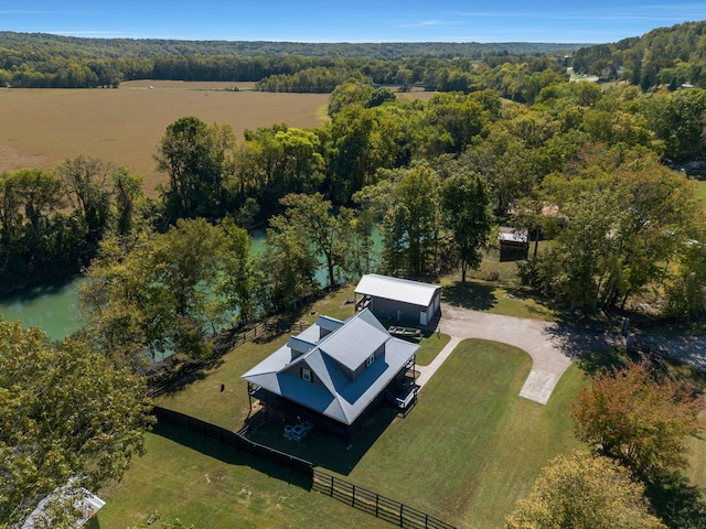 birds eye view of property featuring a rural view and a water view