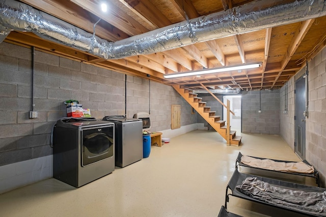 basement with washing machine and clothes dryer