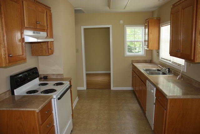 kitchen featuring white appliances and sink