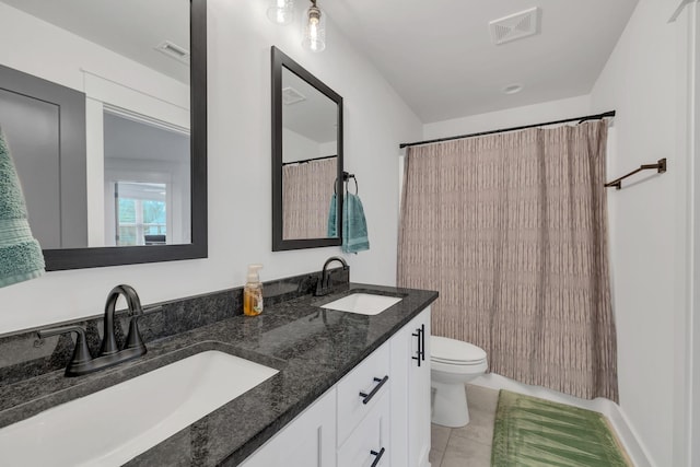 bathroom featuring tile patterned flooring, vanity, toilet, and a shower with shower curtain