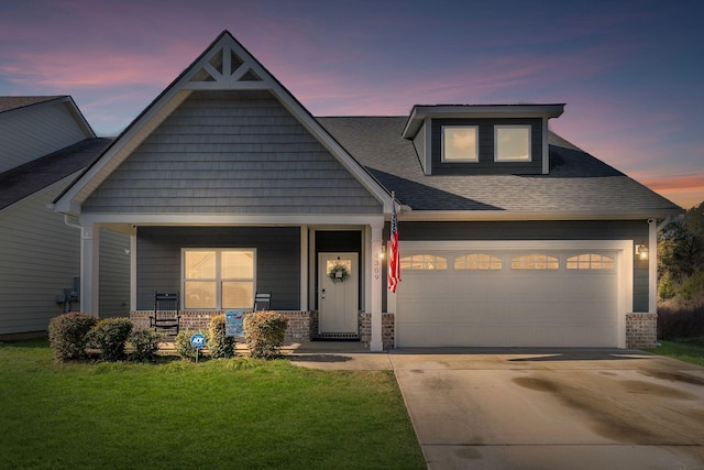 craftsman-style house featuring a yard and covered porch