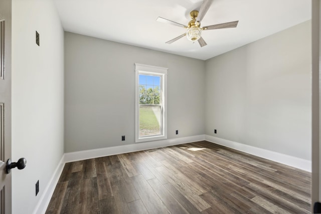 unfurnished room with ceiling fan and dark wood-type flooring