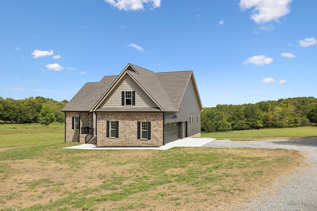 exterior space with a yard and a garage