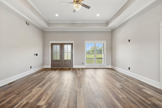 interior space featuring french doors, a raised ceiling, ceiling fan, crown molding, and hardwood / wood-style floors