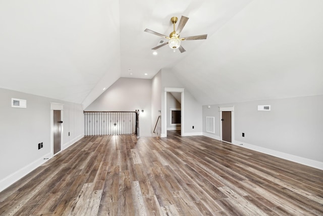 bonus room with ceiling fan, dark hardwood / wood-style flooring, and vaulted ceiling