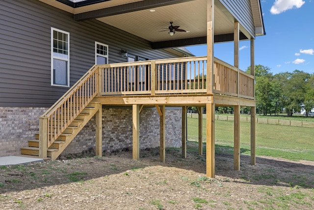 exterior space with ceiling fan and a yard