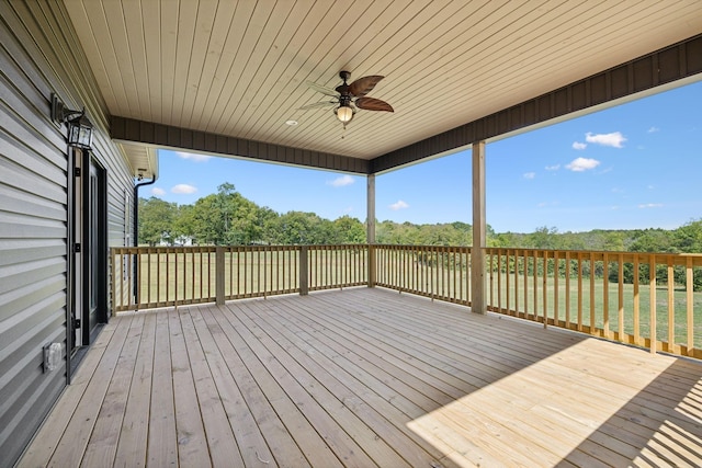 wooden deck featuring ceiling fan