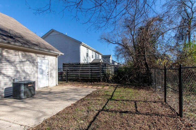 view of yard featuring a patio area and central AC