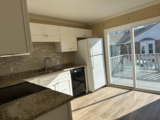 kitchen featuring white cabinets, a textured ceiling, sink, and black appliances