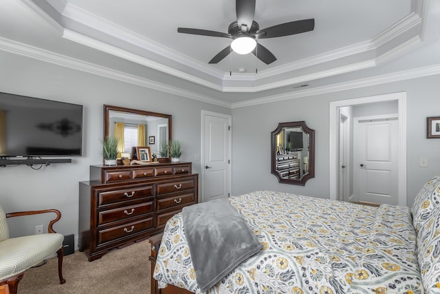 bedroom with light colored carpet, a raised ceiling, ceiling fan, and ornamental molding