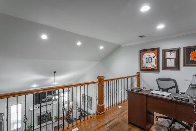 office area with hardwood / wood-style flooring and lofted ceiling