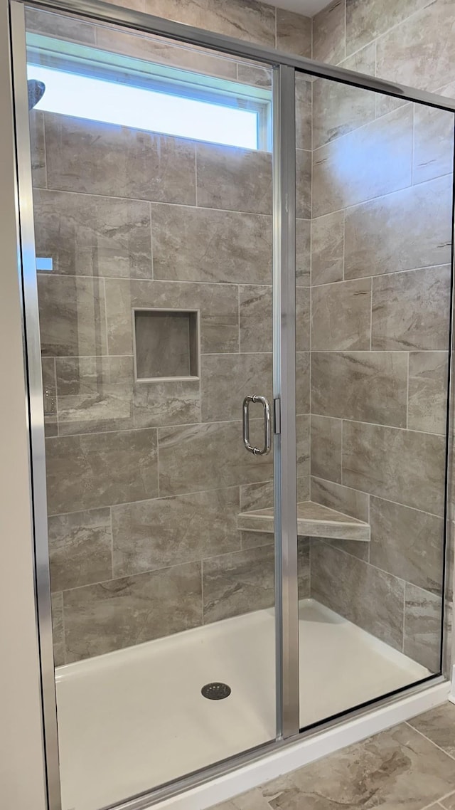 bathroom featuring walk in shower