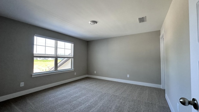 unfurnished room with carpet flooring