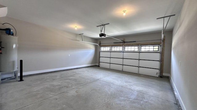 garage with a garage door opener and water heater