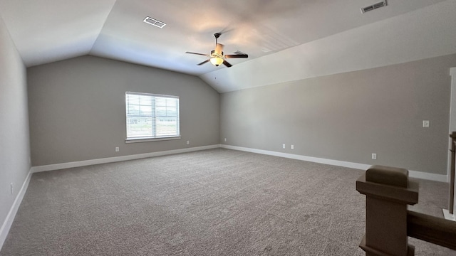 additional living space with carpet floors, ceiling fan, and lofted ceiling