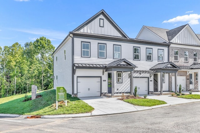 view of front of home featuring a garage and a front lawn