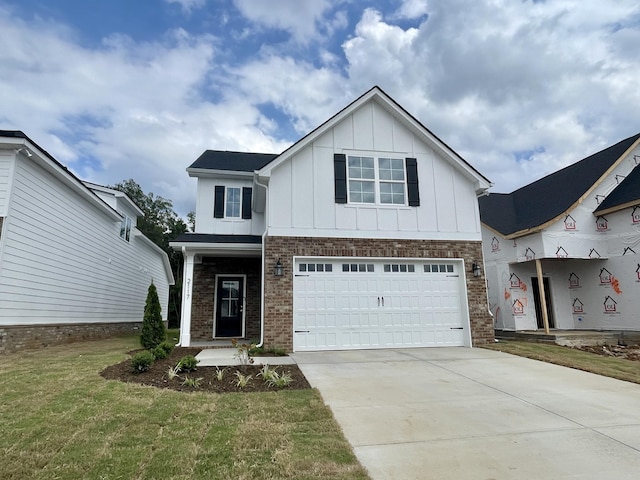 view of front facade featuring a front yard and a garage