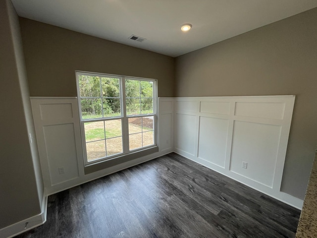 unfurnished room with dark hardwood / wood-style floors