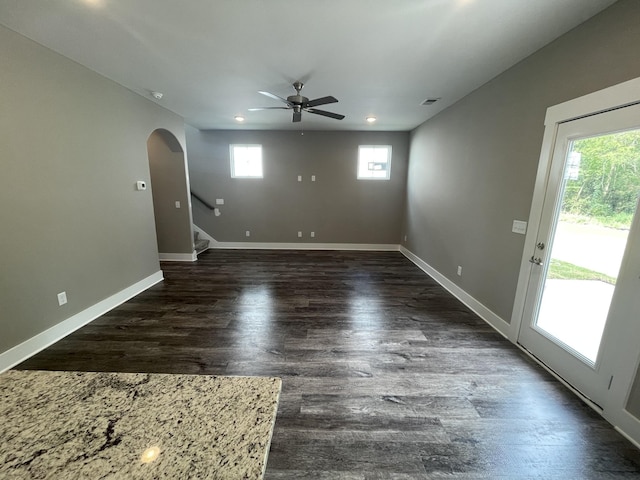 unfurnished room with dark hardwood / wood-style flooring and ceiling fan