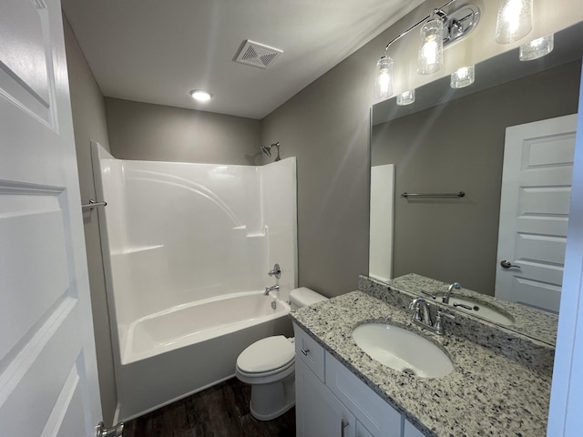 full bathroom featuring bathtub / shower combination, wood-type flooring, vanity, and toilet