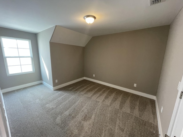 bonus room with carpet and lofted ceiling